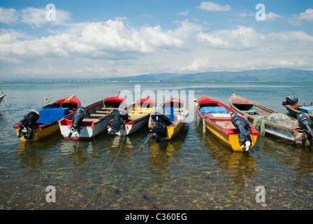 View of colorful fishing boats anchored in Port Royal, across the harbor from Kingston, St Andrew, Jamaica Stock Photo
