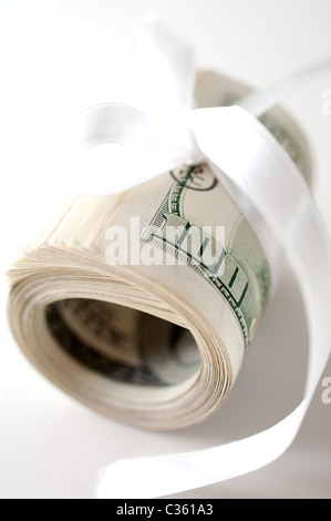 Dollar roll tightened with ribbon Stock Photo