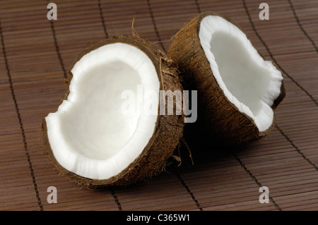 Coconut cracked in two halves Stock Photo
