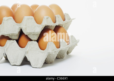 Close up of stack of fresh eggs in cartons with copy space Stock Photo