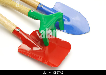 Close up of toy gardening tools on white background Stock Photo