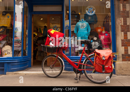 A Royal Mail postmans bike in Cambridge , Cambridgeshire , England , Britain , Uk