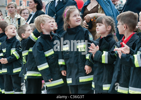 Bajkoludek (Fablefolk) children fire brigade at street show on Firefighters Day festival at Rynek in Wrocław, Poland Stock Photo