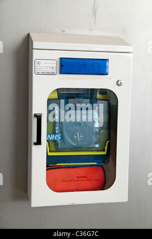 An 'automated external defibrillator' device on the wall inside Stratford Underground station, Stratford, East London, UK. Stock Photo