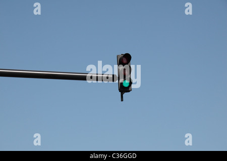 A traffic light showing 'green' (hanging above a road in) Stratford, East London, UK. Stock Photo