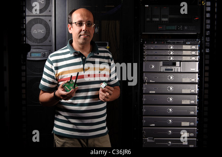 Technician in server room Stock Photo