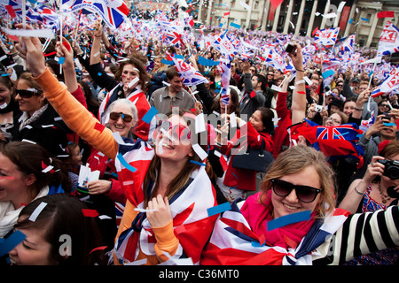 Revelers gather in Trafalgar Square in Central London to celebrate the Royal Wedding of Prince William and Kate Middleton Stock Photo