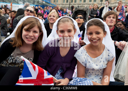 Revelers gather in Trafalgar Square in Central London to celebrate the Royal Wedding of Prince William and Kate Middleton Stock Photo