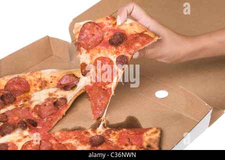 spicy pizza on cardboard box with hand Stock Photo