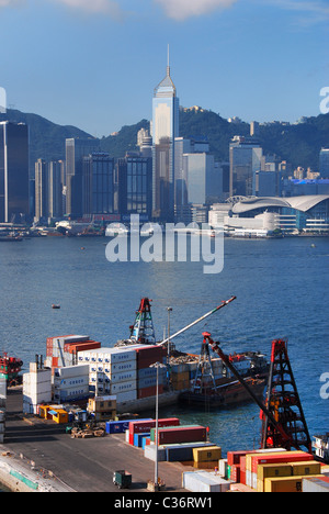 Kowloon container terminal shipping with Kong Kong Island Skyscrapers in the distance across Victoria Harbour Stock Photo
