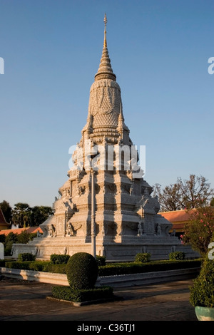 An old Buddhist stupa is illuminated by late afternoon sun at The Royal Palace Museum temple complex in Phnom Penh, Cambodia. Stock Photo