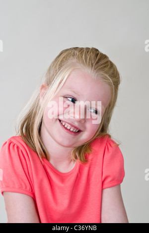 Portrait 5-6 year old shy blond  young girl smiling  children having fun United States MR © Myrleen Pearson Stock Photo