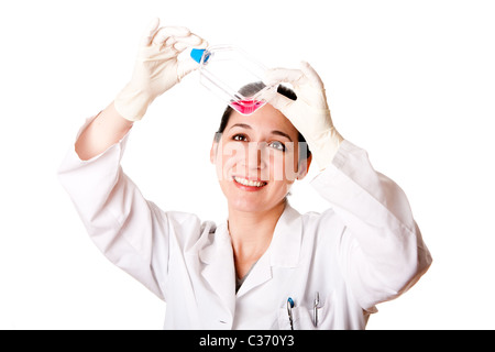 Happy Female scientist researcher looking at red tissue cell culture medium in flask wearing gloves, isolated. Stock Photo