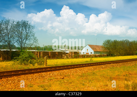 Picturesque landscape with house and rail on countryside Stock Photo