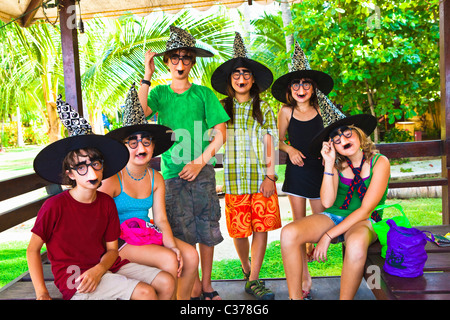 children in witch hats and masks Stock Photo
