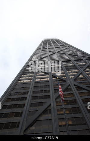 A wide-angle view of Chicago's John Hancock Center (completed 1970), its top stories obscured by clouds Stock Photo