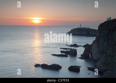 Sunset over South Stack lighthouse, Anglesey, North Wales Stock Photo