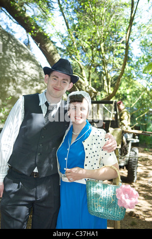 Second World War re-enactment society event held at Hoghton Towers,Lancashire,England. Civilians in 1940s dress Stock Photo