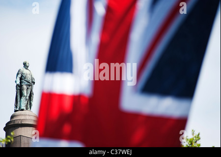 Prince Frederick Duke of York statue on top of the Duke of York column in central London with a union jack flag in The Mall Stock Photo