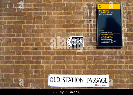 street name sign for old station passage, and signs for capital ring and richmond town centre, in richmond upon thames, england Stock Photo