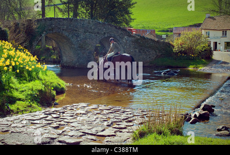 A Horsewoman smiling at Malmsmead,Doone Valley, North Devon Stock Photo