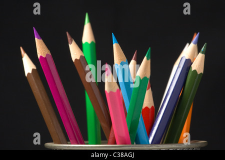 Pencil crayons, container Stock Photo