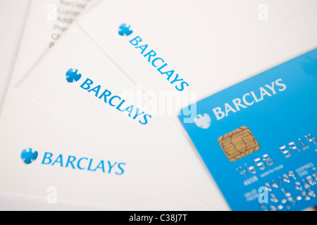 A Barclays current account debit card and cheque paying-in envelopes. Stock Photo