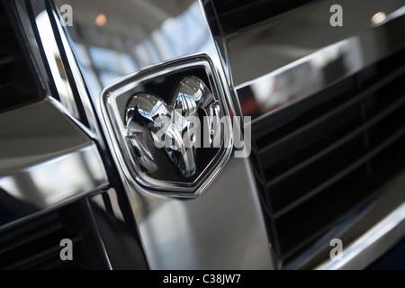 The Dodge emblem logo on the front of a black pick-up truck Stock Photo