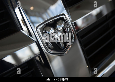 The Dodge emblem logo on the front of a black pick-up truck Stock Photo