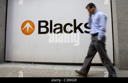 A person passes in front of a branch of Blacks Leisure Group, London. Stock Photo