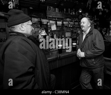 Customers enjoy Guinness in Hells Kitchen Pub, Castlerea, County Roscommon, Ireland. Stock Photo