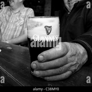 Customers enjoy Guinness in Hells Kitchen Pub, Castlerea, County Roscommon, Ireland. Stock Photo