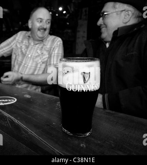 Customers enjoy Guinness in Hells Kitchen Pub, Castlerea, County Roscommon, Ireland. Stock Photo