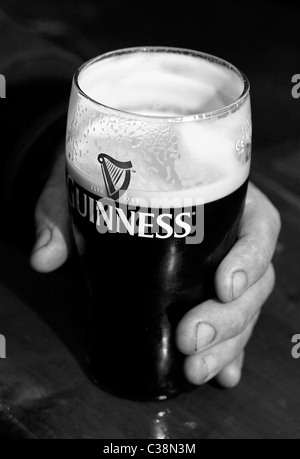 Customers enjoy Guinness in Hells Kitchen Pub, Castlerea, County Roscommon, Ireland. Stock Photo