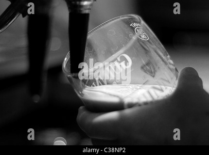 A pint of Guinness being pulled in Sissy McGintys Pub, Castlerea, County Roscommon, Ireland. Stock Photo