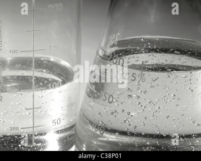 Beakers In Lab With Boiling Liquid & Air Bubbles Stock Photo