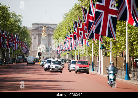 View of The Mall towards Buckingham Palace in central London with Union flags lining the route. Stock Photo