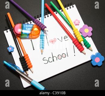 things for school: notebook, colored pencils, rubbers Stock Photo