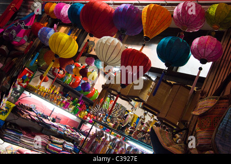Horizontal night time view of a shop on Hang Be street selling Vietnamese handicrafts in the centre of the Old Quarter in Hanoi Stock Photo