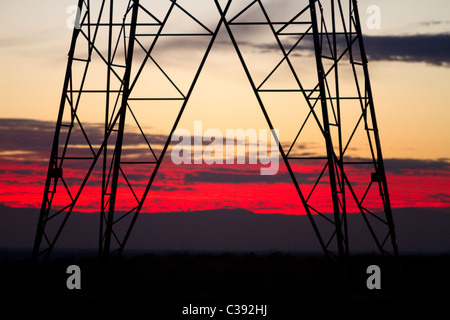 Electric transmission tower and sunset near Boise, Idaho, USA. Stock Photo