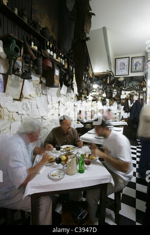 Friends eating at typical restaurant Zé Manel dos Ossos in Coimbra, Portugal Stock Photo