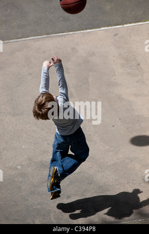 Young boy playing street basketball in Riverside Park, New York City. Stock Photo