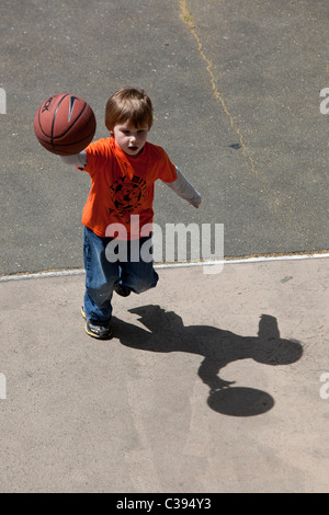 Young boy playing street basketball in Riverside Park, New York City. Stock Photo