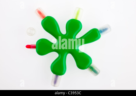 Unusual shaped green kiddies multicolored felt tip pens Stock Photo