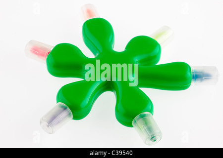 Unusual shaped green kiddies multicolored felt tip pens Stock Photo