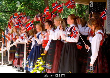 Children celebrating Norway Day waving Norwegian and American flags at Minnehaha Park. Minneapolis Minnesota MN USA Stock Photo