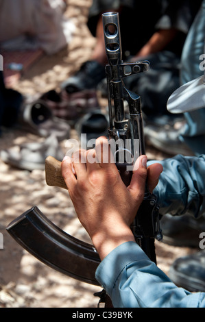 AK47 held by Afghan policeman in Helmand Stock Photo