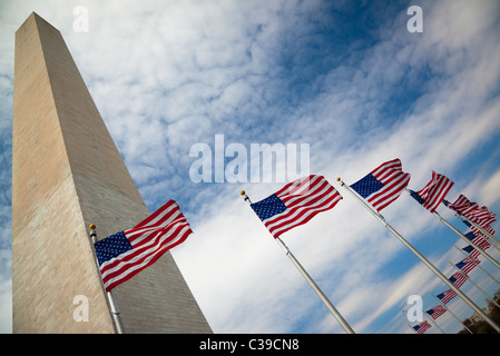 The Washington Monument at the National Mall in Washington, DC surrounded by American flags Stock Photo