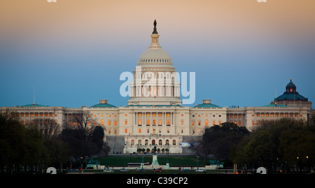 The United States Capitol at the end of the National Mall in Washington, DC, seen at sunset