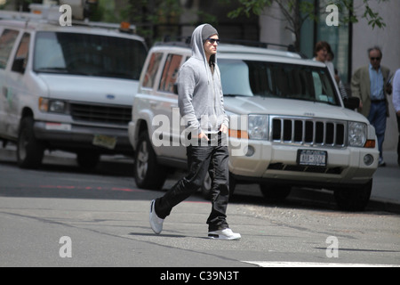 Justin Timberlake wearing a grey hoodie and sunglasses walking in SoHo New York City, USA - 11.05.09 Stock Photo